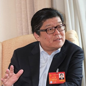 王刚:用政策和市场手段力推绿色节能建筑