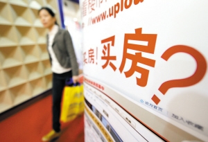 售楼员笑逐颜开:买房人增多 热闹程度今年从未见过